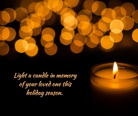 A single candle burns against a black background with the words..Light a candle in memory of your loved one this holiday season.