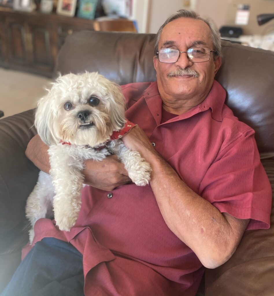 Man in red shirt with dog